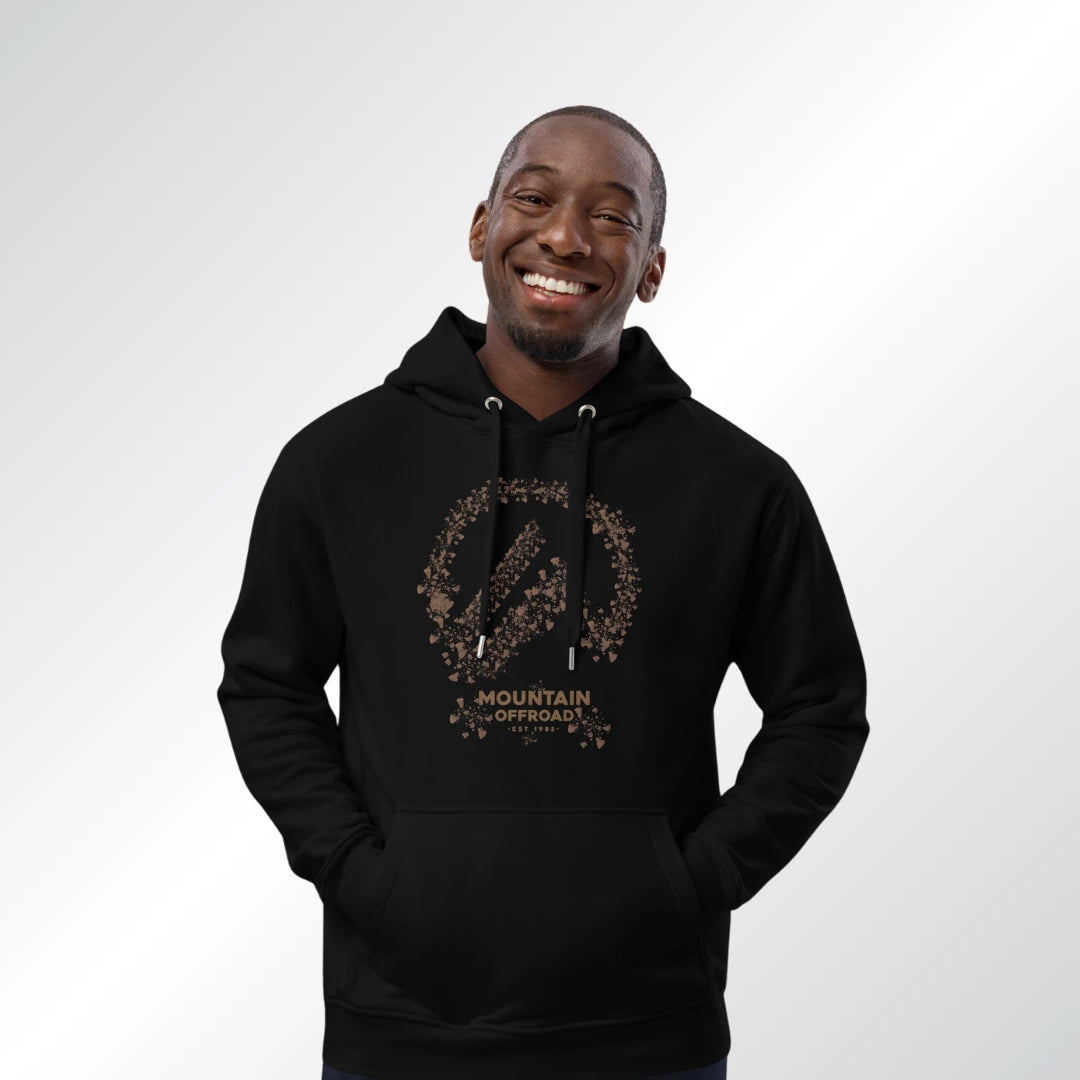 A man smiling in a black hoodie with the Mountain Offroad logo made of tire tracks, styled for everyday wear or trail days—ideal with jeep cj parts and jeep parts catalog builds.