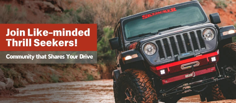 A black Jeep Wrangler navigating rough terrain, equipped with jeep wrangler armor, perfect for thrill seekers who want to explore the outdoors with confidence.