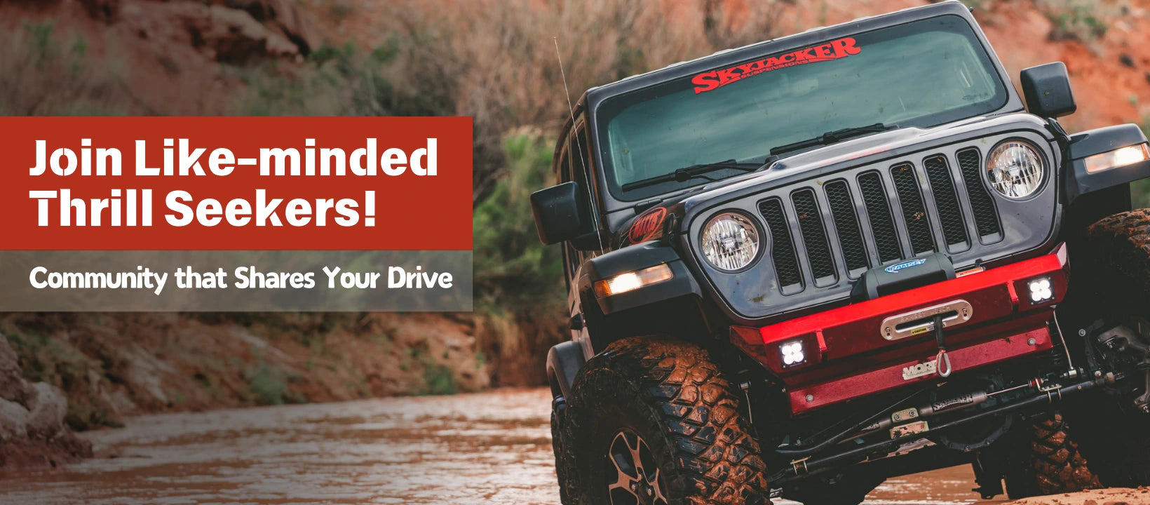 A black Jeep Wrangler navigating rough terrain, equipped with jeep wrangler armor, perfect for thrill seekers who want to explore the outdoors with confidence.
