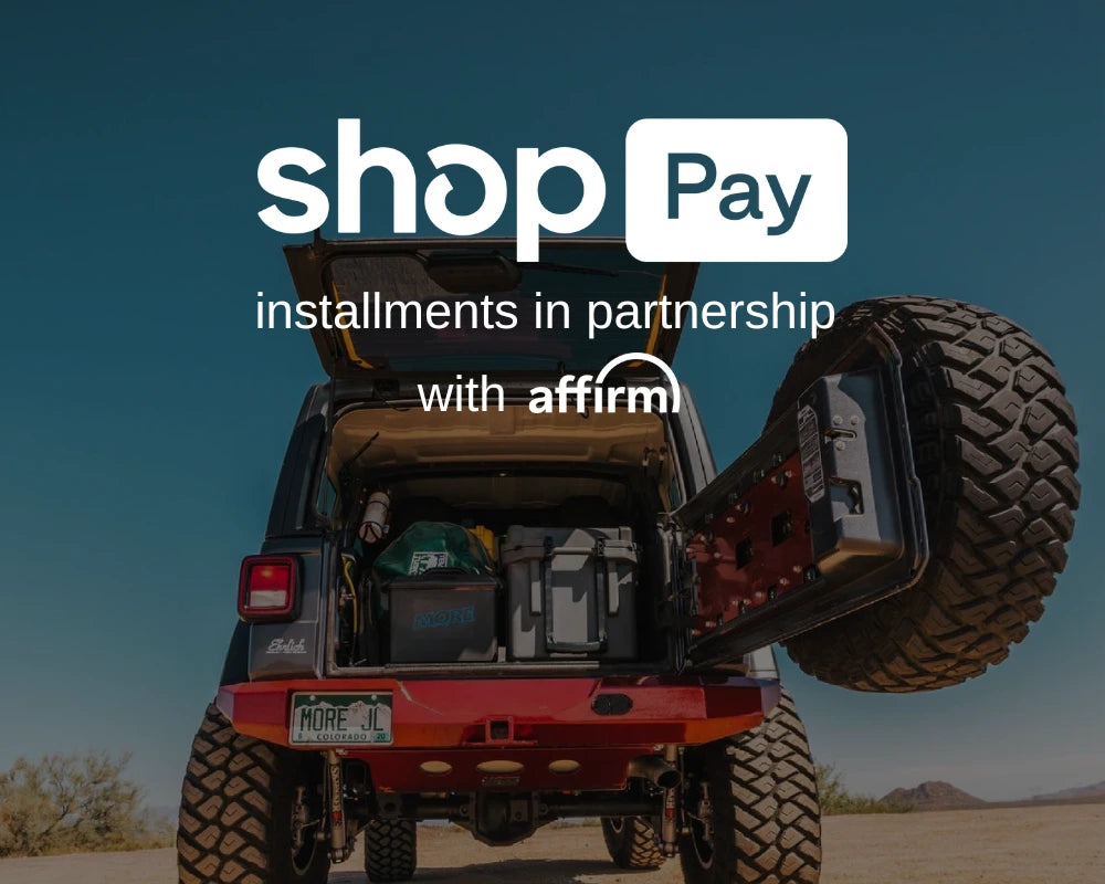 Rear view of a red Jeep with open tailgate packed for adventure, showcasing off-road storage gear—perfect for rigs equipped with jeep cherokee xj parts and jeep wrangler armor.